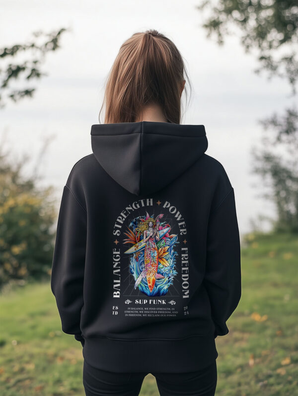 Women's Black regular hoodie made from Organic Cotton with a large abstract style image printed on the back with the words Balance, Strength, Power and Freedom in white. The hoodie is finished off with Vibrant SUP Funk logo on the front left chest.