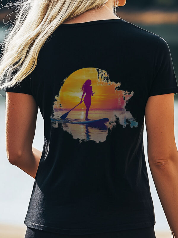 Close Up of Women's Black regular fit T-Shirt made from 100% Organic Cotton with a large image printed on the back of a female paddle boarder set against a setting sun. The tee is finished off with Vibrant Orange SUP Funk logo on the front left chest.