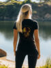 Women's Black regular fit T-Shirt made from 100% Organic Cotton with a large image printed on the back with the words Unstoppable Force, Unbreakable Spirit. The tee is finished off with Vibrant Orange SUP Funk logo on the front left chest.