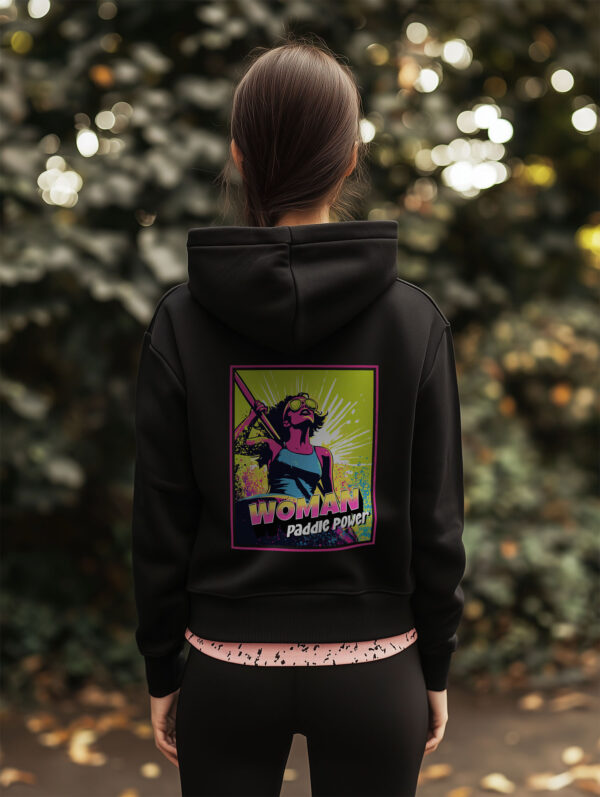 Women's Black regular fit Hoodie made from Organic Cotton with a large vibrant pink and lime green comic style print on the back with the words Woman Paddle Power.