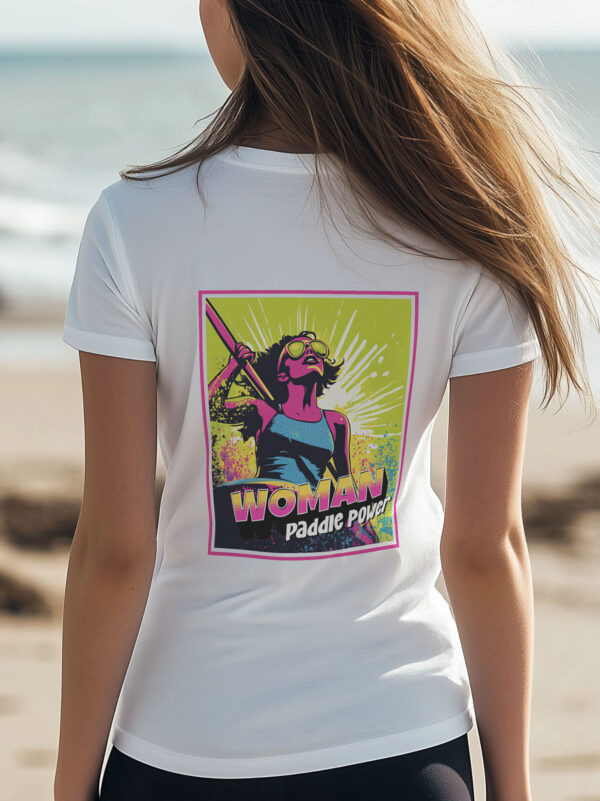 Back view of women's white regular fit T-Shirt made from 100% Organic Cotton with a large vibrant pink and lime green comic style image of female paddle boarder with the words Woman Paddle Power.