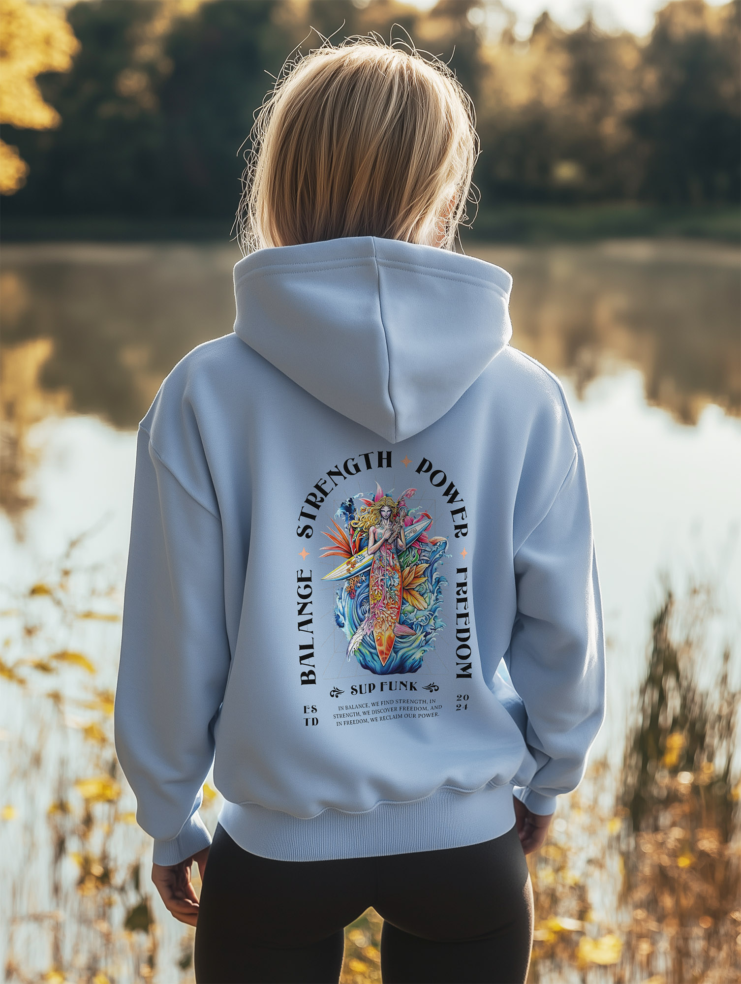 Women's Serene Blue regular hoodie made from Organic Cotton with a large abstract style image printed on the back with the words Balance, Strength, Power and Freedom in Black. The hoodie is finished off with Vibrant SUP Funk logo on the front left chest.