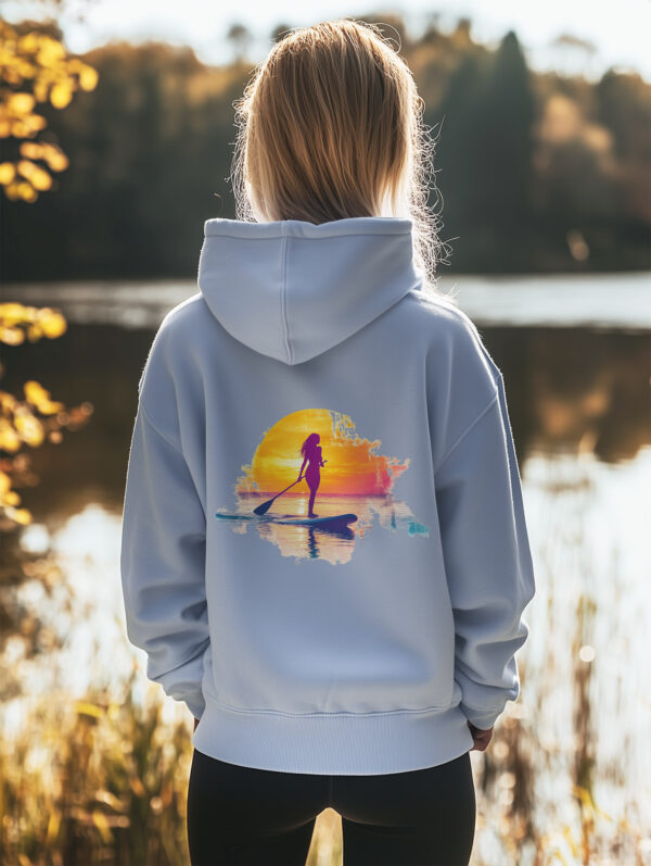 Women's Serene Blue regular fit hoodie made from 85% Organic Cotton, 15% recycled polyester with a large image printed on the back of a female paddle boarder set against a setting sun. The hoodie is finished off with Vibrant Orange SUP Funk logo on the front left chest.