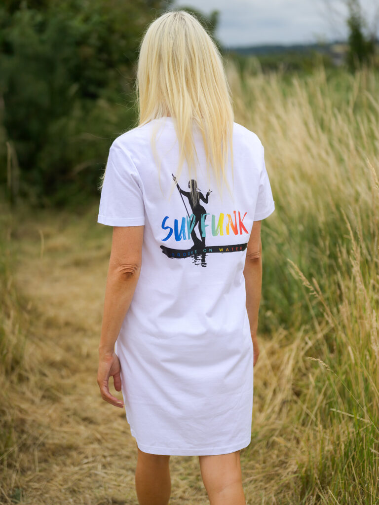 Model wearing a white Groove on water T-Shirt dress by SUP Funk