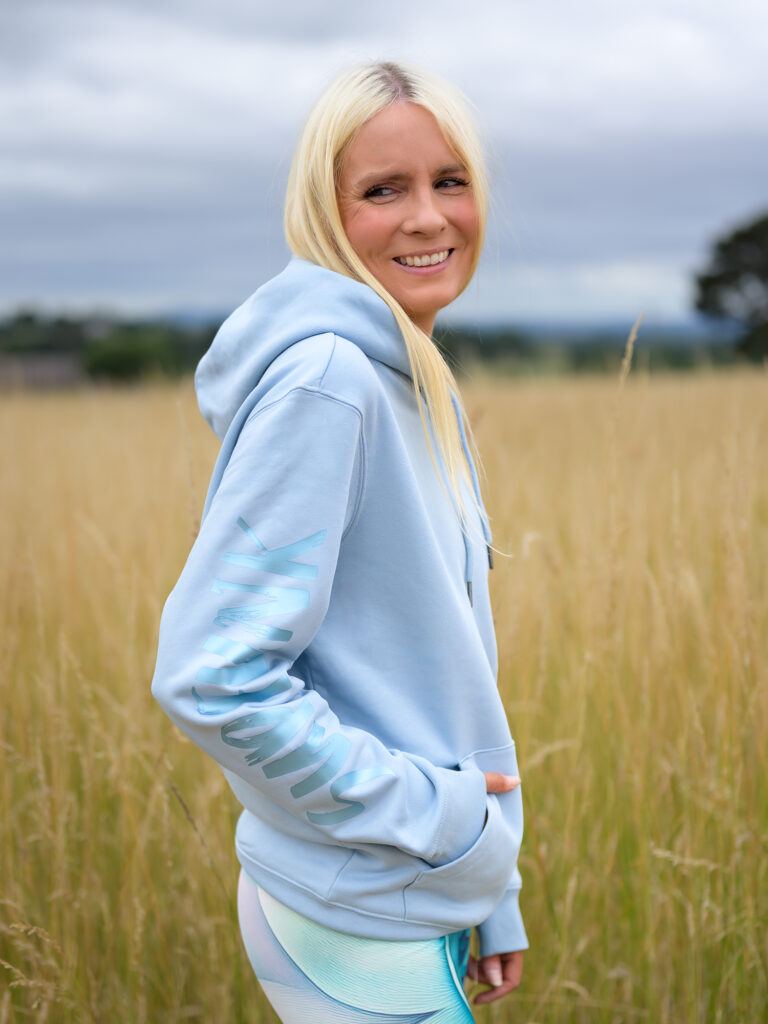 Woman wearing Signature Luxe Collection Hoodie Aquamarine by SUP Funk