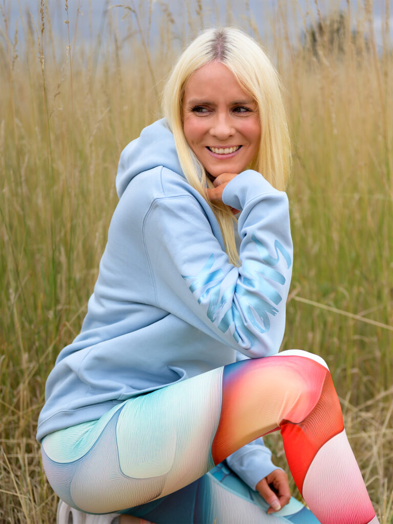Woman wearing Signature Luxe Collection Hoodie Aquamarine by SUP Funk