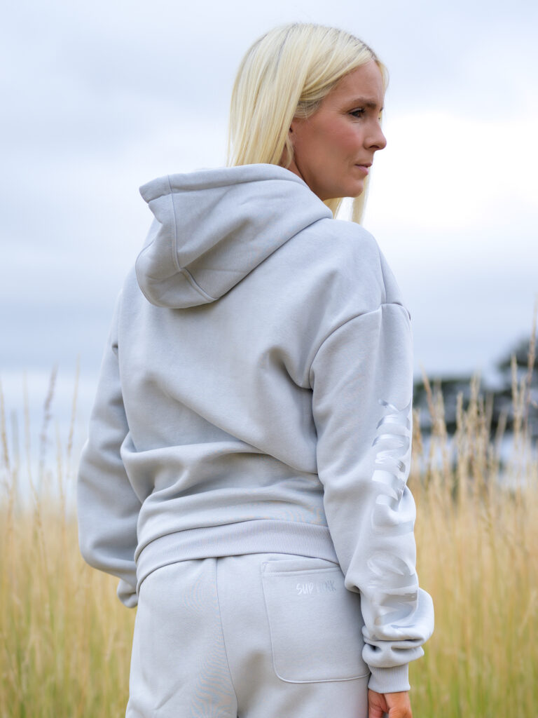 Woman wearing Signature Luxe Collection Hoodie in Asphalt Colour by SUP Funk