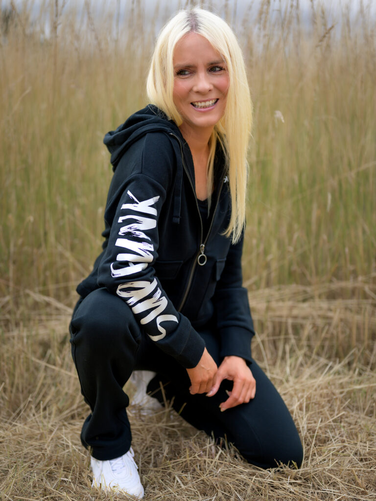 Women wearing Signature Luxe Collection Zip Hoodie Jacked in black by SUP Funk