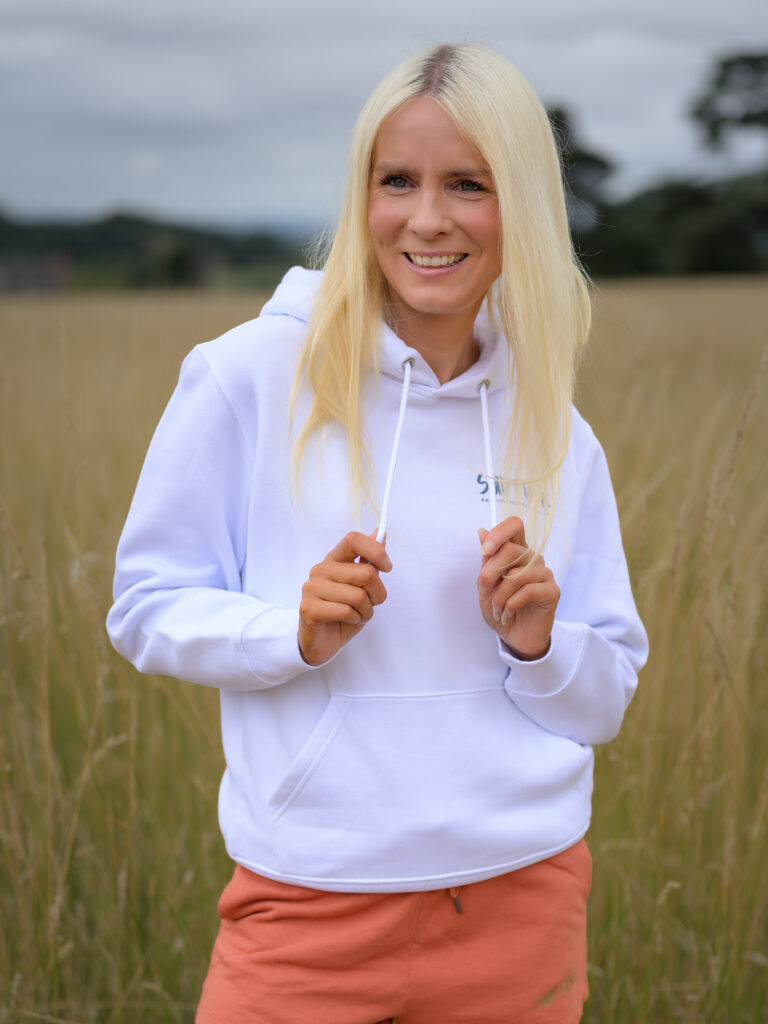 Woman wearing the incredible white Power Paddle Boarding hoodie by SUP Funk