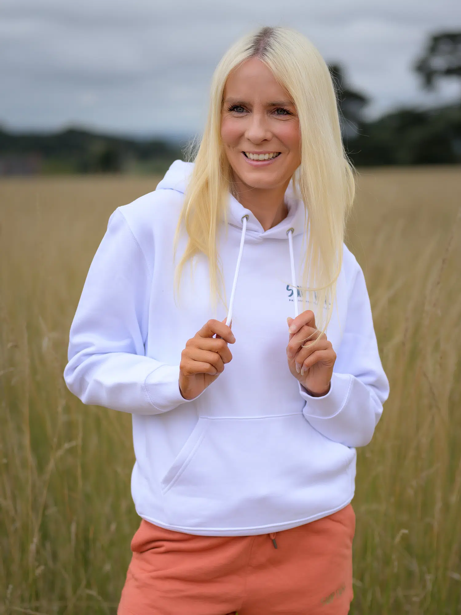 Woman wearing the incredible white Power Paddle Boarding hoodie by SUP Funk