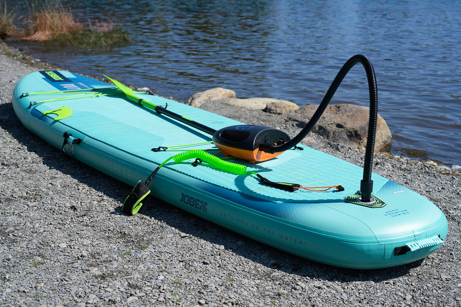 outdoor-master-shark-2S-review-3 Outdoor Master Shark 2S being used to inflate a Jobe Loa Paddleboard