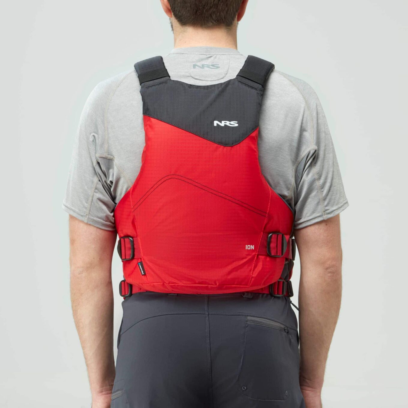 Model wearing NRS Ion PFD Red Colour Buoyancy Aid Back View