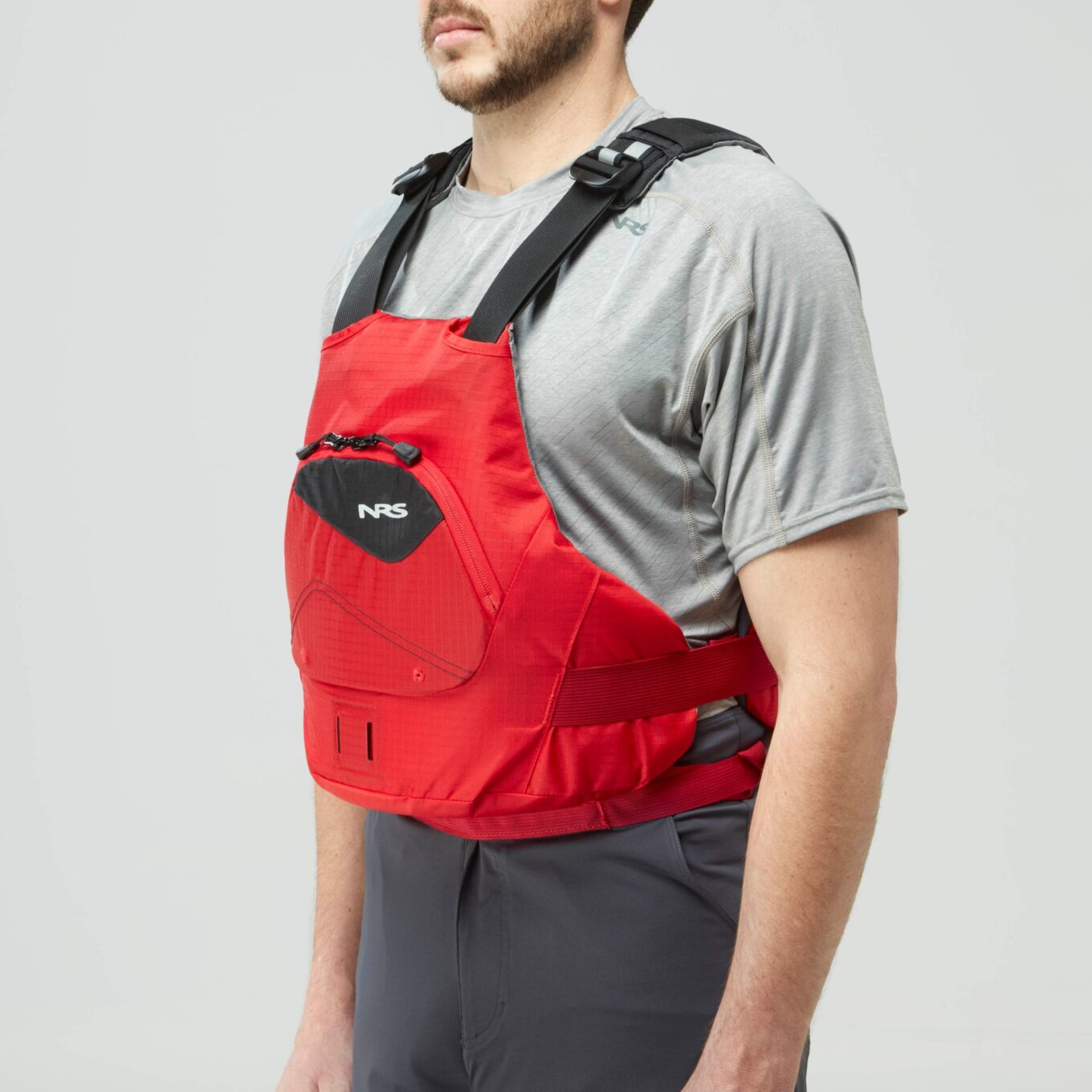 Model wearing NRS Ion PFD Red Colour Buoyancy Aid Left View