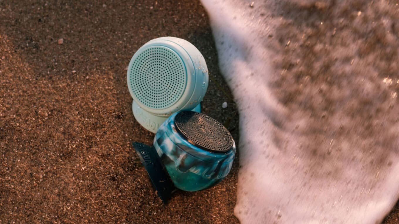 Two Speaqua Barnacle Pro 2.0 Waterproof Speakers on the beach