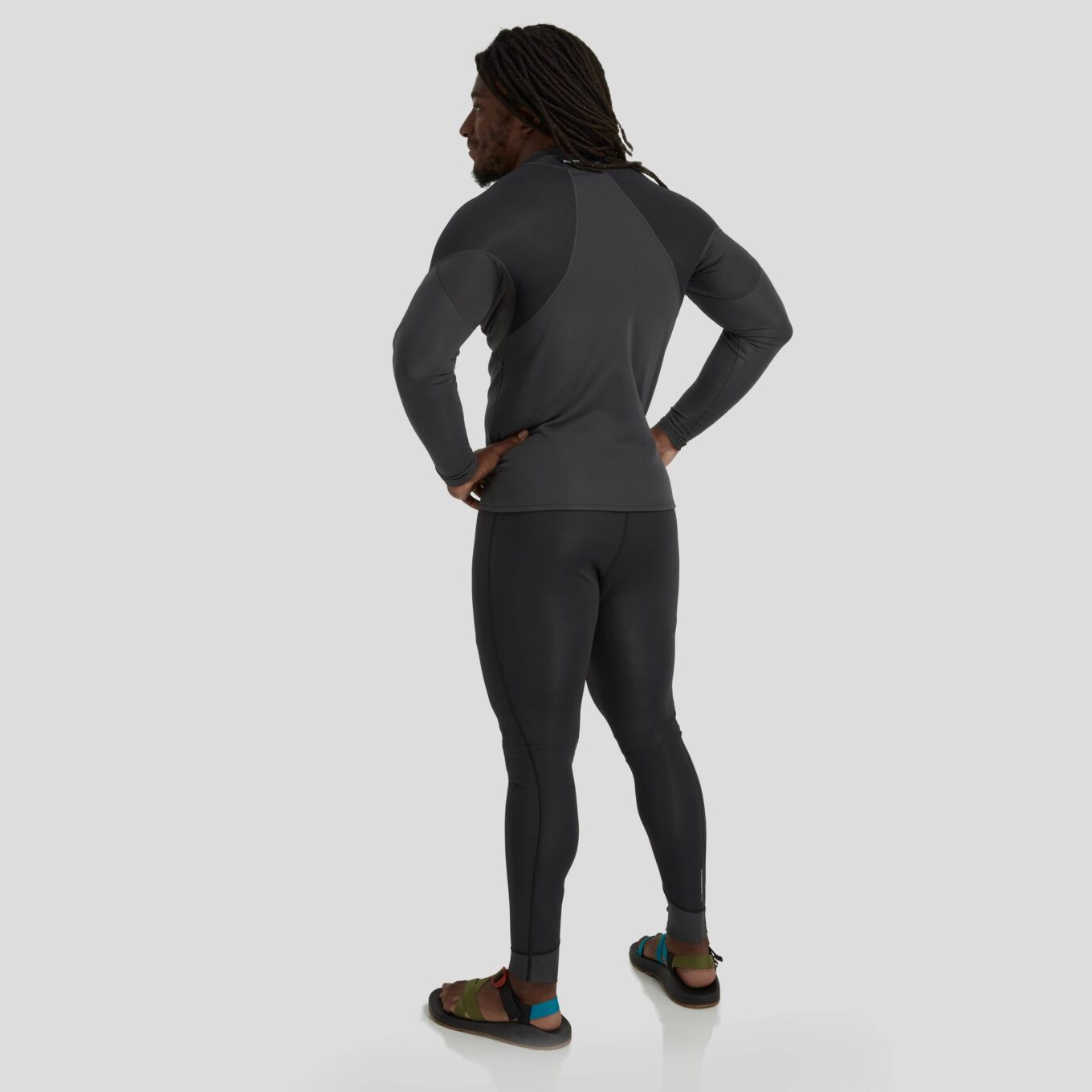 Rear view of a model wearing NRS men’s HydroSkin 1.5mm neoprene trousers